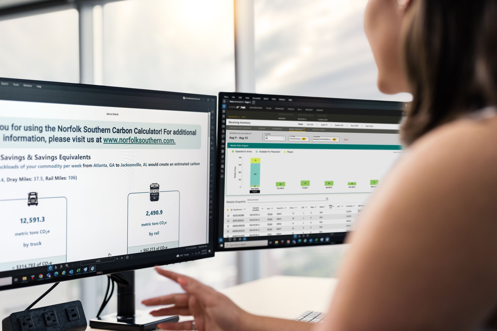 A Norfolk Southern employee views a monitor screen that shows the railway company’s carbon calculator, which aims to reduce carbon emissions for automotive rail shipping service.