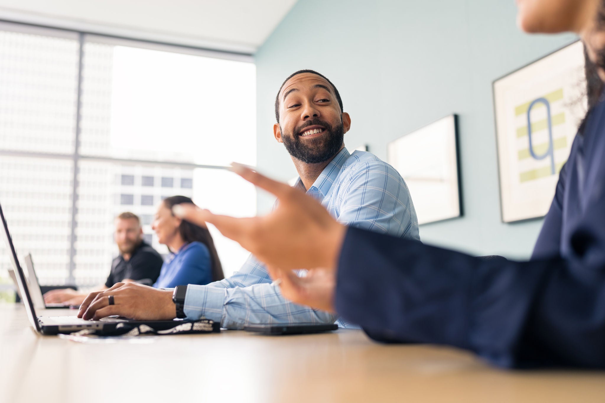 Employees collaborating in the office at an employee resource group that supports Norfolk Southern’s inclusive workplace culture.